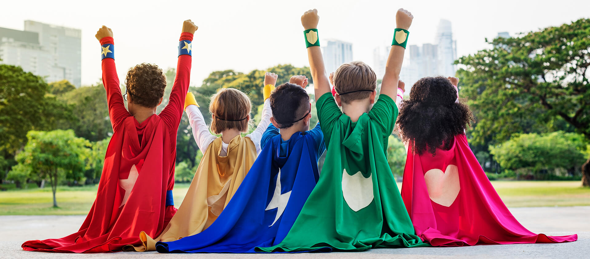 Little kids dressed as superheroes